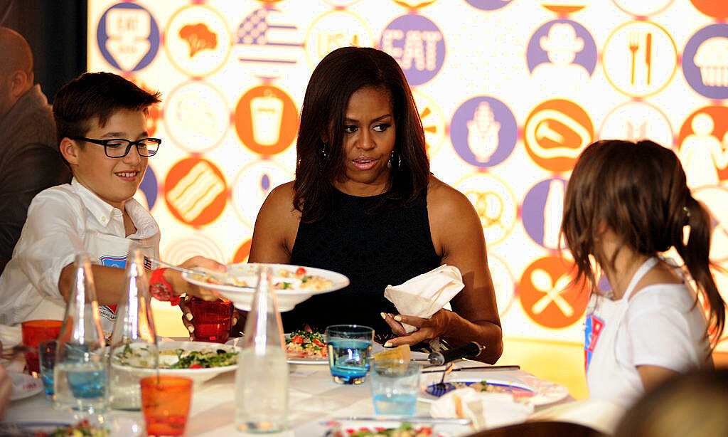 MILAN, ITALY - JUNE 17:  First Lady Michelle Obama hosts a cooking demonstration for local students at the James Beard American Restaurant on June 17, 2015 in Milan, Italy. After visiting London, Michelle Obama has travelled to Italy where she is expected to speak about her 'Let's Move' initiative to combat childhood obesity.  (Photo by Pier Marco Tacca/Getty Images)