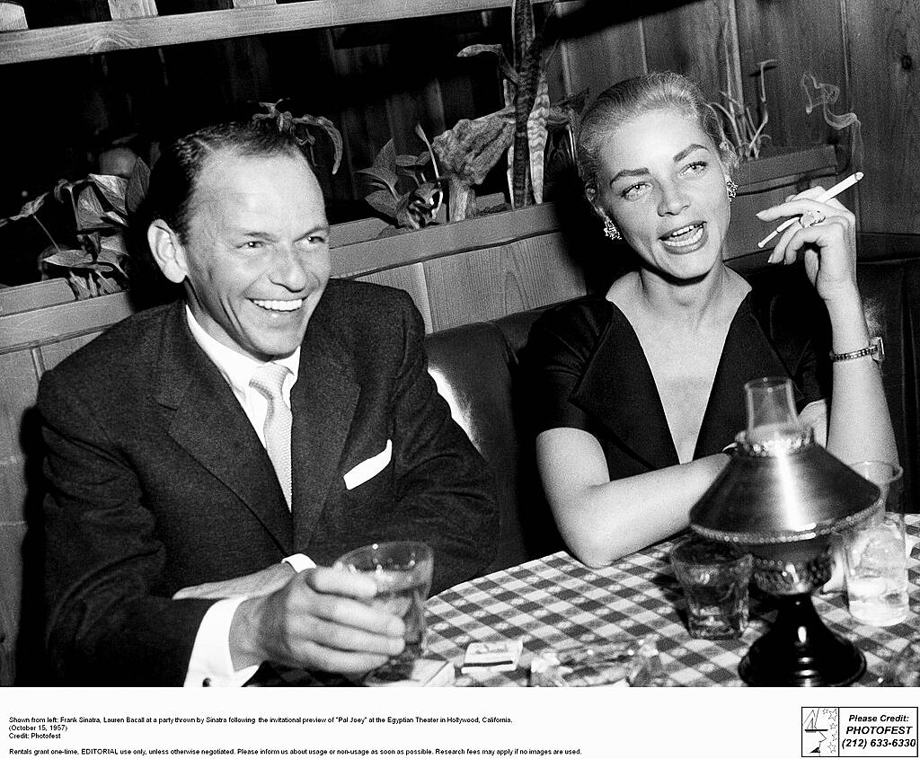 Shown from left: Frank Sinatra, Lauren Bacall at a party thrown by Sinatra following  the invitational preview of "Pal Joey" at the Egyptian Theater in Hollywood, California.
(October 15, 1957)


WENN.com