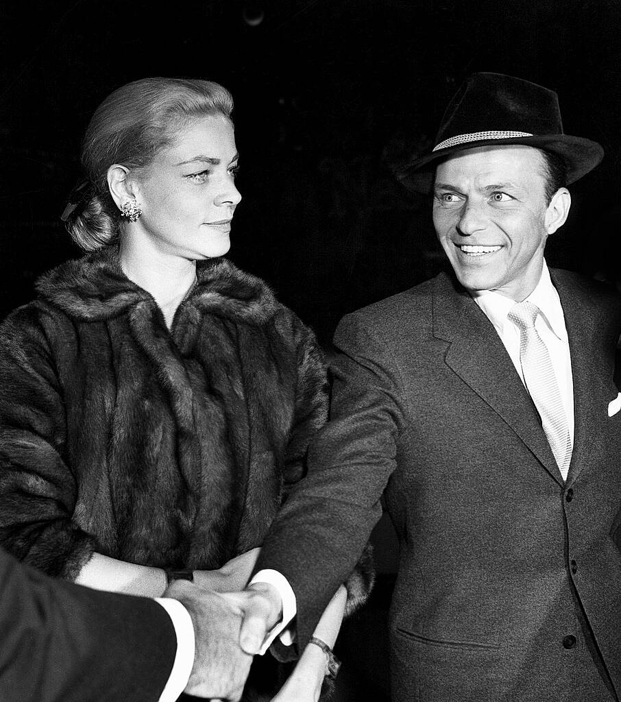 Shown from left: Lauren Bacall, Frank Sinatra arriving at the Egyptian Theater in Hollywood, California for the invitational preview of "Pal Joey."  (October 15, 1957)

 WENN.com
