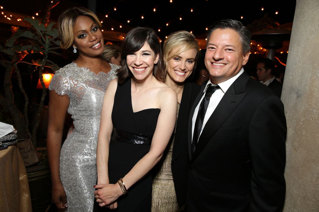 Laverne Cox, Carrie Brownstein, Taylor Schilling and Chief Content Officer of Netflix Inc., Ted Sarandos seen at the Netflix Celebration of the 66th Primetime Emmy Awards held at the Chateau Marmont on Monday, August 25, 2014, in Los Angeles. (Photo by Eric Charbonneau/Invision for Netflix]/AP Images)