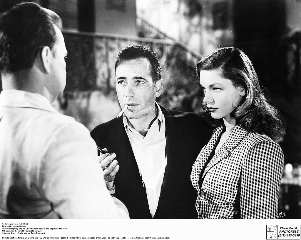 To Have and Have Not (1944)
Directed by Howard Hawks
Shown from left: Walter Sande (as Johnson), Humphrey Bogart (as Harry 'Steve' Morgan), Lauren Bacall (as Marie 'Slim' Browning)


WENN.com
