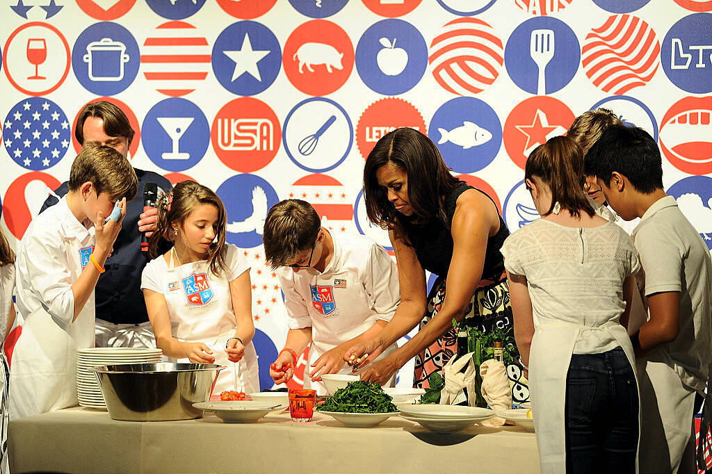 MILAN, ITALY - JUNE 17:  First Lady Michelle Obama hosts a cooking demonstration for local students at the James Beard American Restaurant on June 17, 2015 in Milan, Italy. (Photo by Pier Marco Tacca/Getty Images)