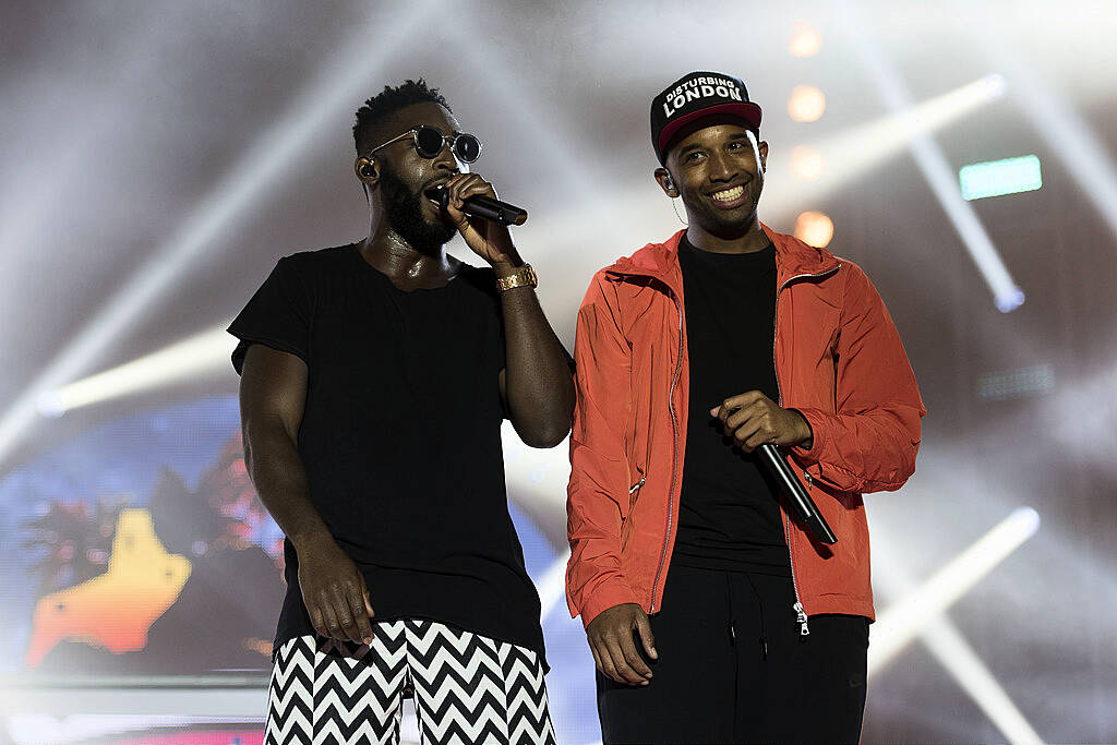 PLYMOUTH, ENGLAND - JULY 22: Tinie Tempah (L) performs on stage during MTV Crashes Plymouth at Plymouth Hoe on July 22, 2014 in Plymouth, England. (Photo by Matthew Horwood/Getty Images for MTV UK)