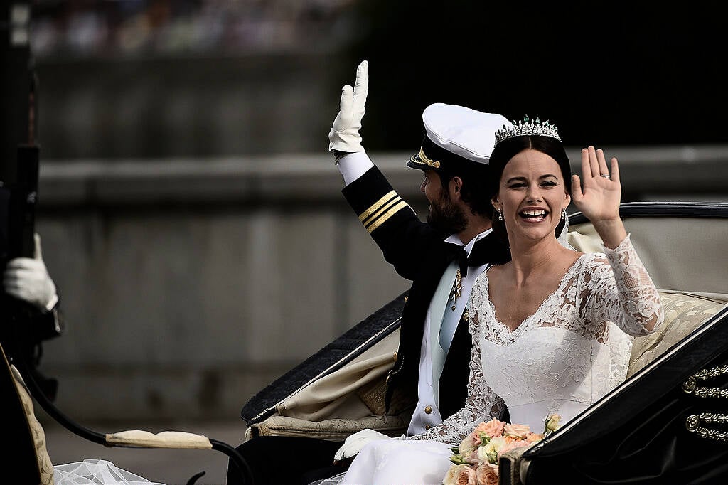 STOCKHOLM, SWEDEN - JUNE 13:  Prince Carl Philip of Sweden and his wife Princess Sofia of Sweden ride in the wedding cortege after their marriage ceremony on June 13, 2015 in Stockholm, Sweden.  (Photo by Ian Gavan/Getty Images)