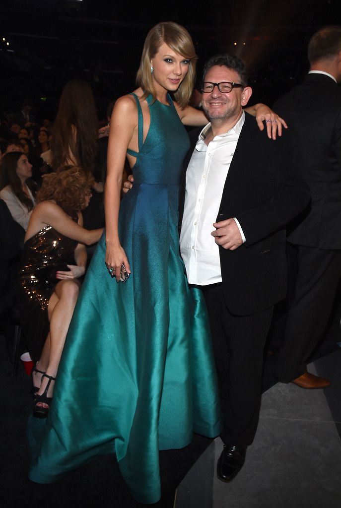 Recording artist Taylor Swift (L) and UMG Worldwide CEO Lucian Grainge attend The 57th Annual GRAMMY Awards at the STAPLES Center on February 8, 2015 in Los Angeles, California.  (Photo by Larry Busacca/Getty Images for NARAS)