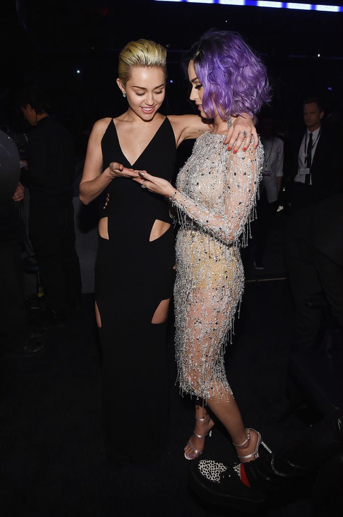 Recording Artists Miley Cyrus and Katy Perry attend The 57th Annual GRAMMY Awards at the STAPLES Center on February 8, 2015 in Los Angeles, California.  (Photo by Larry Busacca/Getty Images for NARAS)