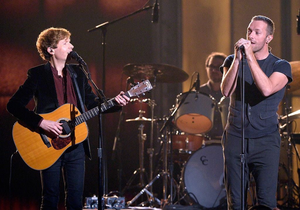 Recording artists Beck (L) and Chris Martin perform "Heart Is a Drum" onstage during The 57th Annual GRAMMY Awards at the at the STAPLES Center on February 8, 2015 in Los Angeles, California.  (Photo by Kevork Djansezian/Getty Images)
