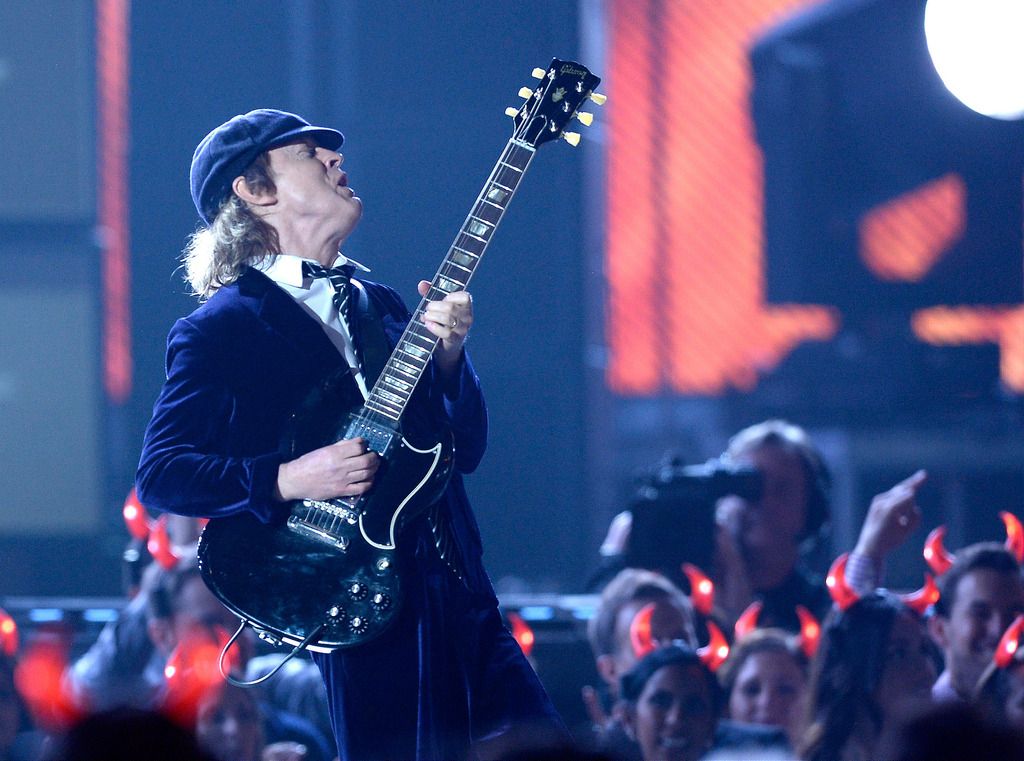  Guitarist Angus Young of AC/DC performs onstage during The 57th Annual GRAMMY Awards at the at the STAPLES Center on February 8, 2015 in Los Angeles, California.  (Photo by Kevork Djansezian/Getty Images)
