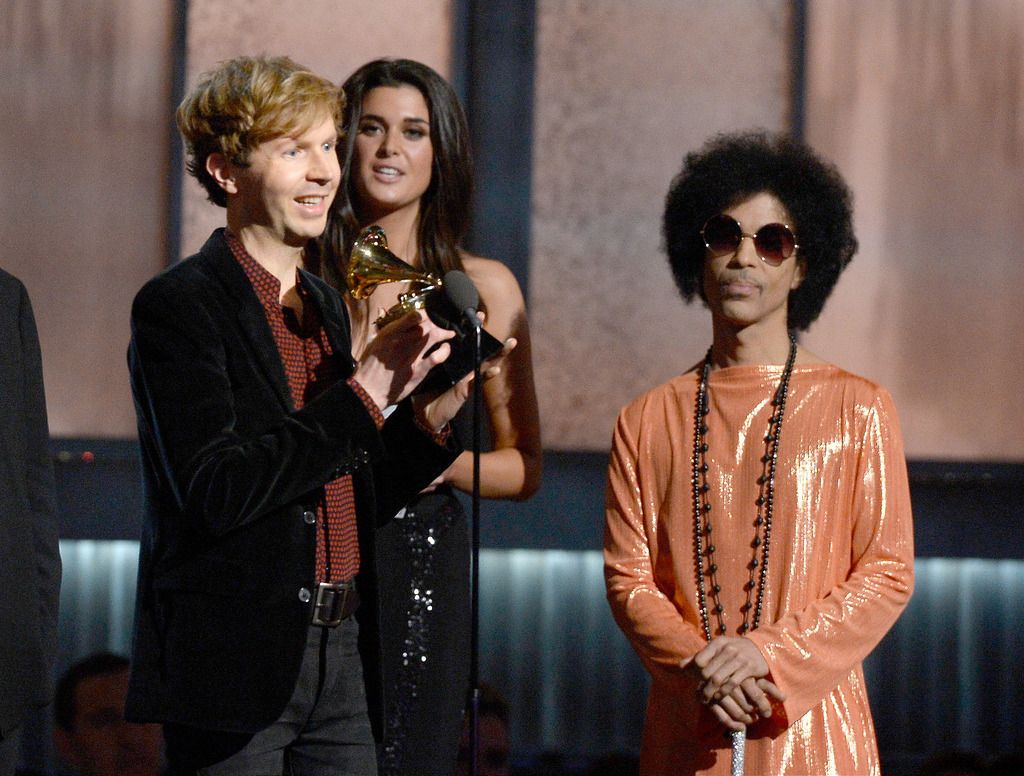 Musician Beck (L) accepts the Album of the Year award for "Morning Phase" from musician Prince onstage during The 57th Annual GRAMMY Awards at the at the STAPLES Center on February 8, 2015 in Los Angeles, California.  (Photo by Kevork Djansezian/Getty Images)