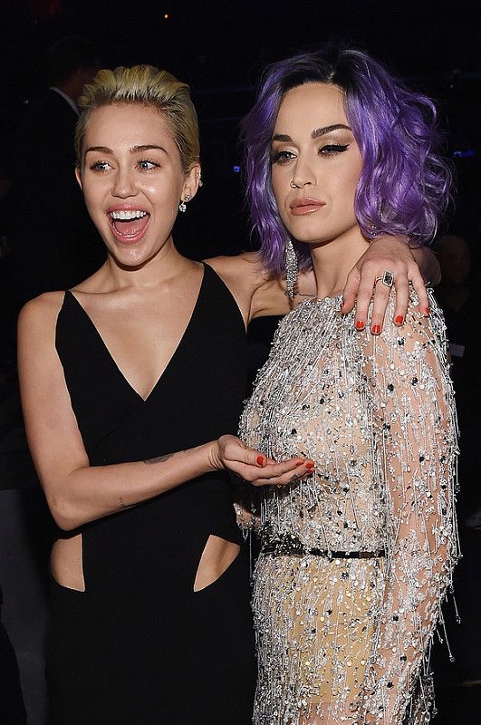 Singer-songwriters Miley Cyrus (L) and Katy Perry attend The 57th Annual GRAMMY Awards at the STAPLES Center on February 8, 2015 in Los Angeles, California.  (Photo by Larry Busacca/Getty Images for NARAS)