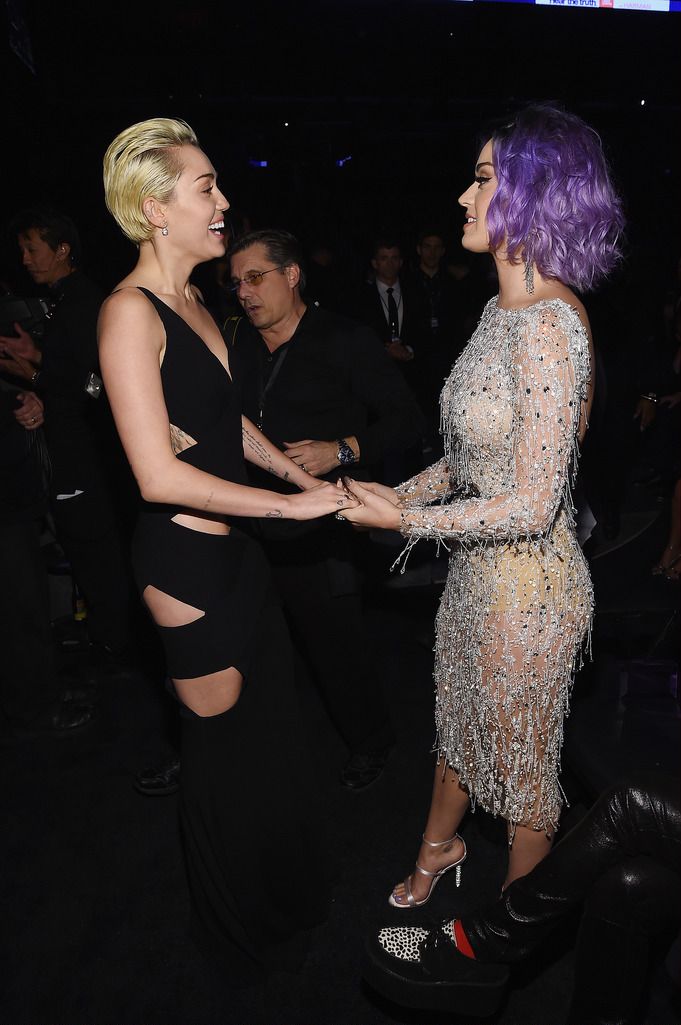 Singer-songwriters Miley Cyrus (L) and Katy Perry attend The 57th Annual GRAMMY Awards at the STAPLES Center on February 8, 2015 in Los Angeles, California.  (Photo by Larry Busacca/Getty Images for NARAS)