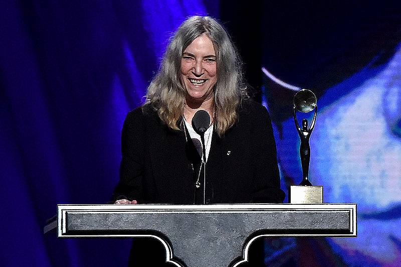 CLEVELAND, OH - APRIL 18:  Patti Smith inducts Lou Reed onstage during the 30th Annual Rock And Roll Hall Of Fame Induction Ceremony at Public Hall on April 18, 2015 in Cleveland, Ohio.  (Photo by Mike Coppola/Getty Images)