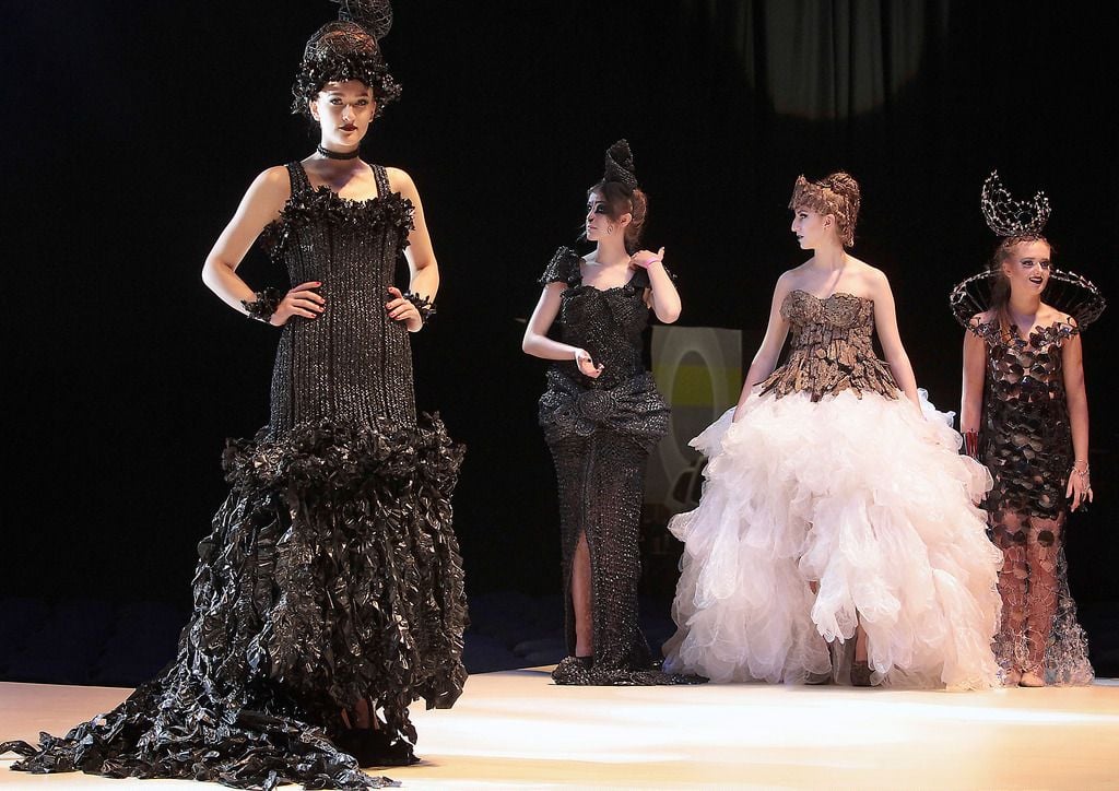 A Dress entitled "Frayed in the Dark"  made from black plastic bags and is modelled by Paulina Vilimaite from Loreto, Balbriggan  (Left) at the final of The Bank of Ireland Junk Kouture Competition in association with Repak at The 3 Arena,Dublin on Friday night..Picture:Brian McEvoy.