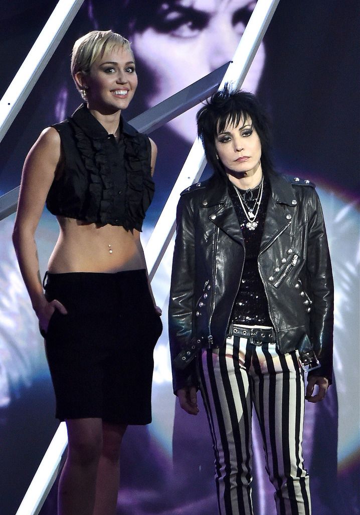 CLEVELAND, OH - APRIL 18:  Inductee Joan Jett of Joan Jett and The Blackhearts (L) and Miley Cyrus pose onstage during the 30th Annual Rock And Roll Hall Of Fame Induction Ceremony at Public Hall on April 18, 2015 in Cleveland, Ohio.  (Photo by Mike Coppola/Getty Images)