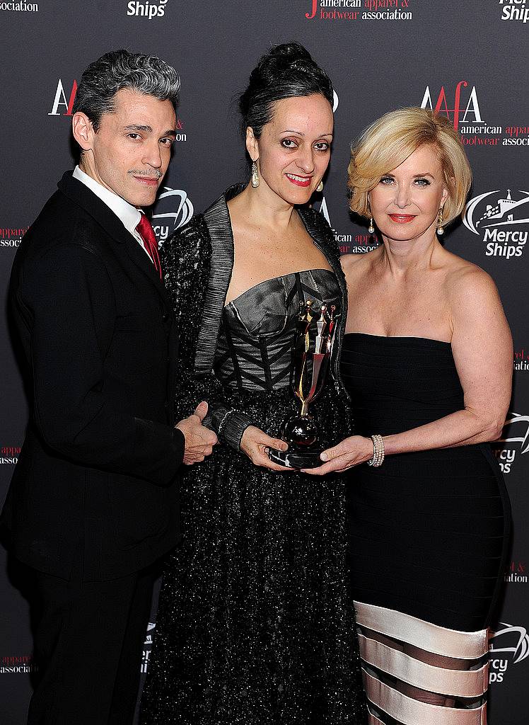 NEW YORK, NY - APRIL 27:  AAFA Statuette Designers Ruben Toledo (L) and Isabel Toledo (C) pose with AAFA President & CEO Juanita D. Duggan during the 2015 AAFA American Image Awards on April 27, 2015 in New York City.  (Photo by Andrew Toth/Getty Images for American Image Awards)