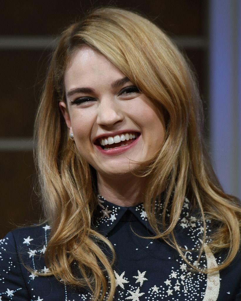 British actree Lily James smiles as she answers questions during a press conference to promote her latest movie "Cinderella" in Tokyo on April 7, 2015.  The film will be shown all over Japan from April 25.    AFP PHOTO / Toru YAMANAKA        (Photo credit should read TORU YAMANAKA/AFP/Getty Images)