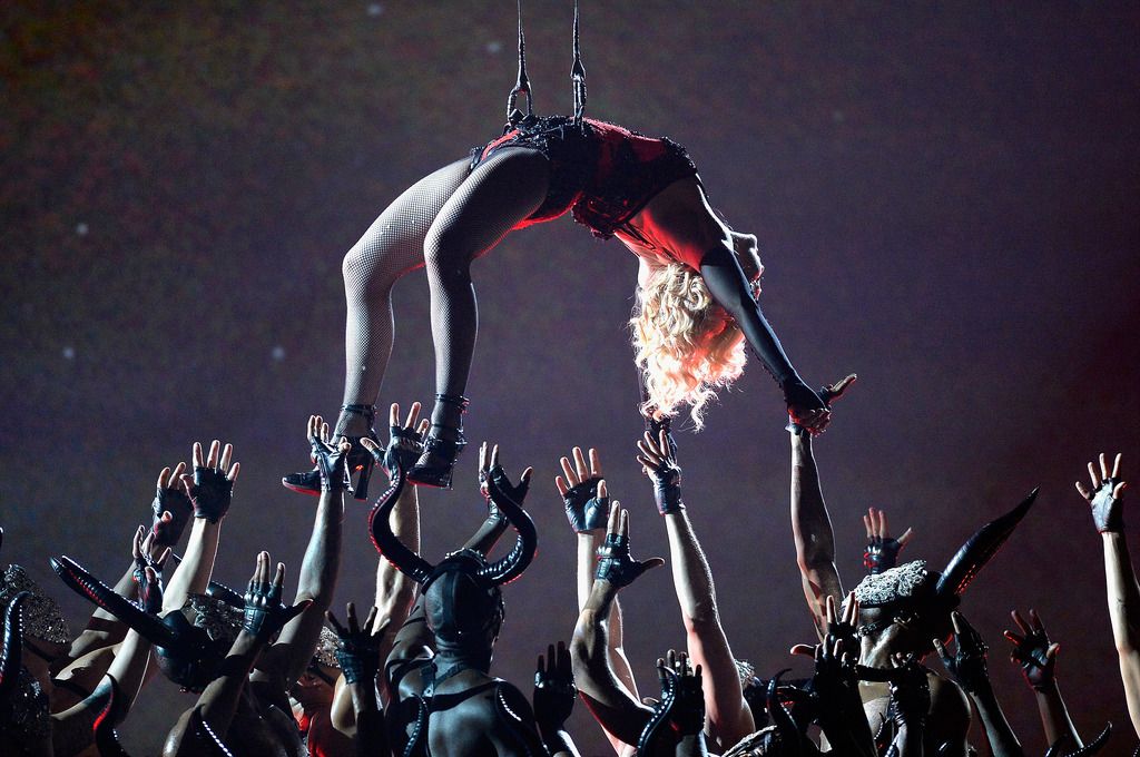 Madonna performs "Living for Love" onstage during The 57th Annual GRAMMY Awards at the at the STAPLES Center on February 8, 2015 in Los Angeles, California.  (Photo by Kevork Djansezian/Getty Images)