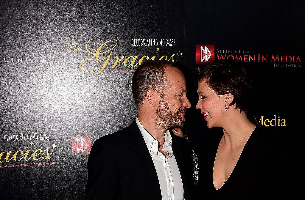 Actress Maggie Gyllenhaal and her husband Peter on arrival for the 40th anniversary of the Gracies Awards in Beverly Hills, California on May 19, 2015, presented by The Alliance for Women in Media.   AFP PHOTO/ FREDERIC J. BROWN        (Photo credit should read FREDERIC J. BROWN/AFP/Getty Images)