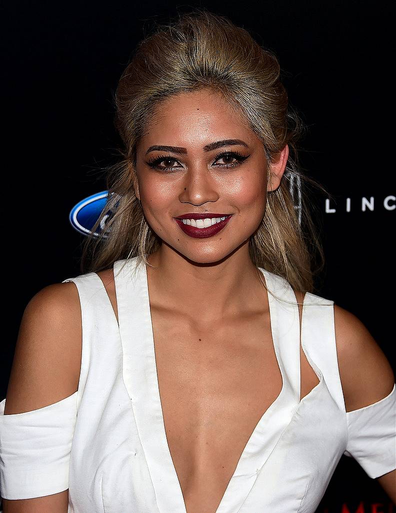 DJ Amy Pham poses on arrival for the 40th anniversary of the Gracies Awards in Beverly Hills, California on May 19, 2015, presented by The Alliance for Women in Media.   AFP PHOTO / FREDERIC J. BROWN        (Photo credit should read FREDERIC J. BROWN/AFP/Getty Images)