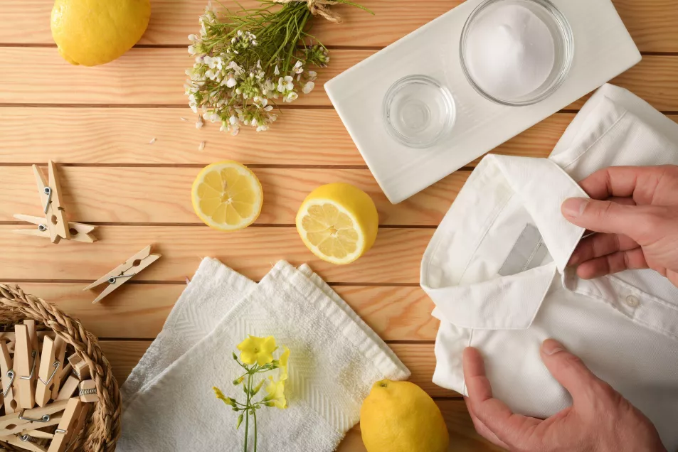 Man cleaning clothes with homemade ecological products 