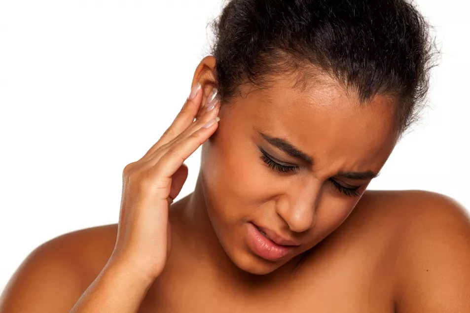 woman with pain in her ear 