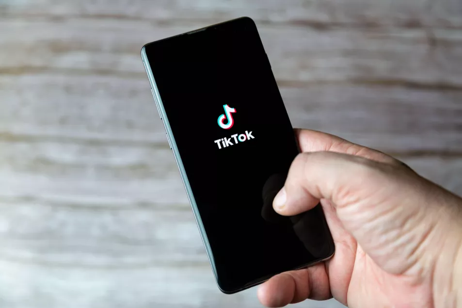 A phone with TikTok on the screen