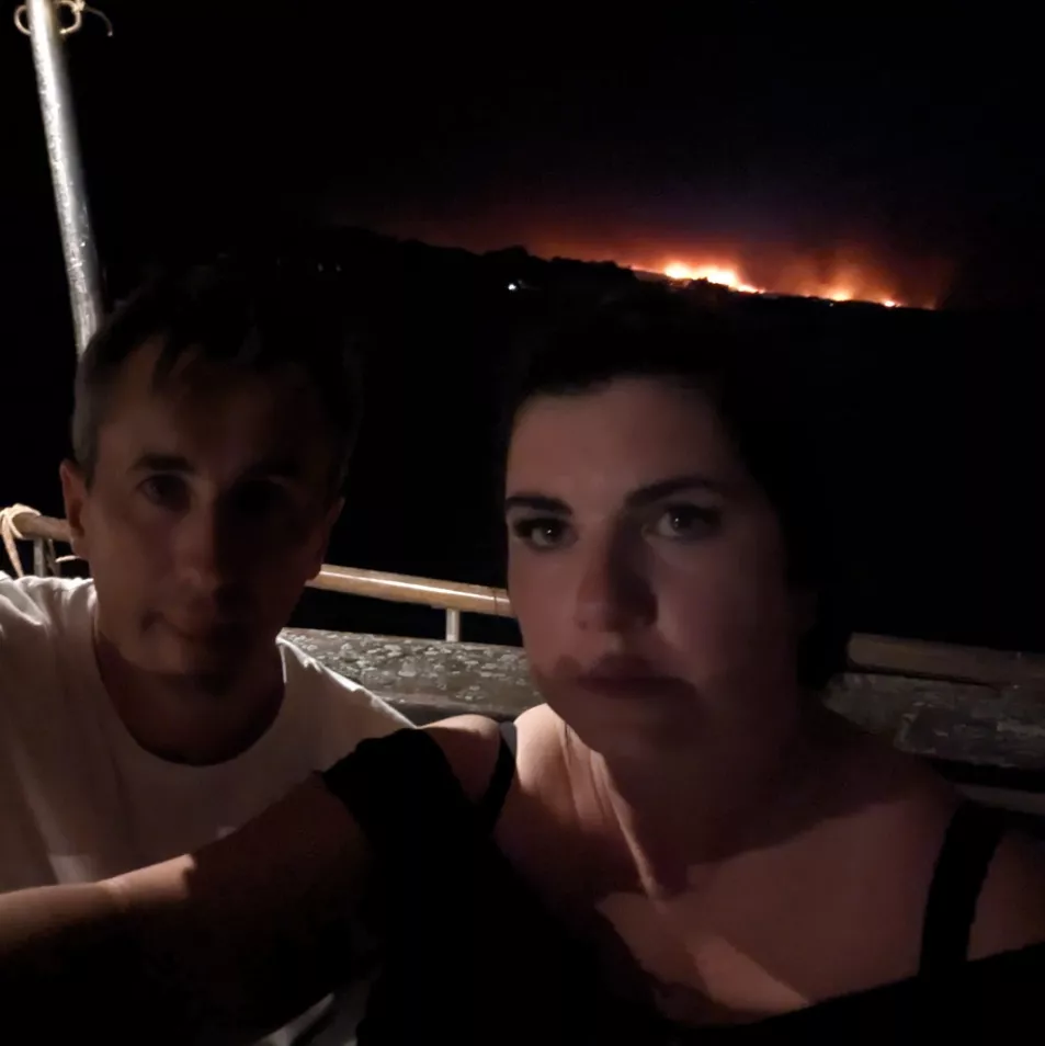 Conor and Danielle Cullen on a boat that would take them to a safer part of the Greek Island of Rhodes as they were forced to evacuate due to wildfire. (Handout/Conor Cullen).
