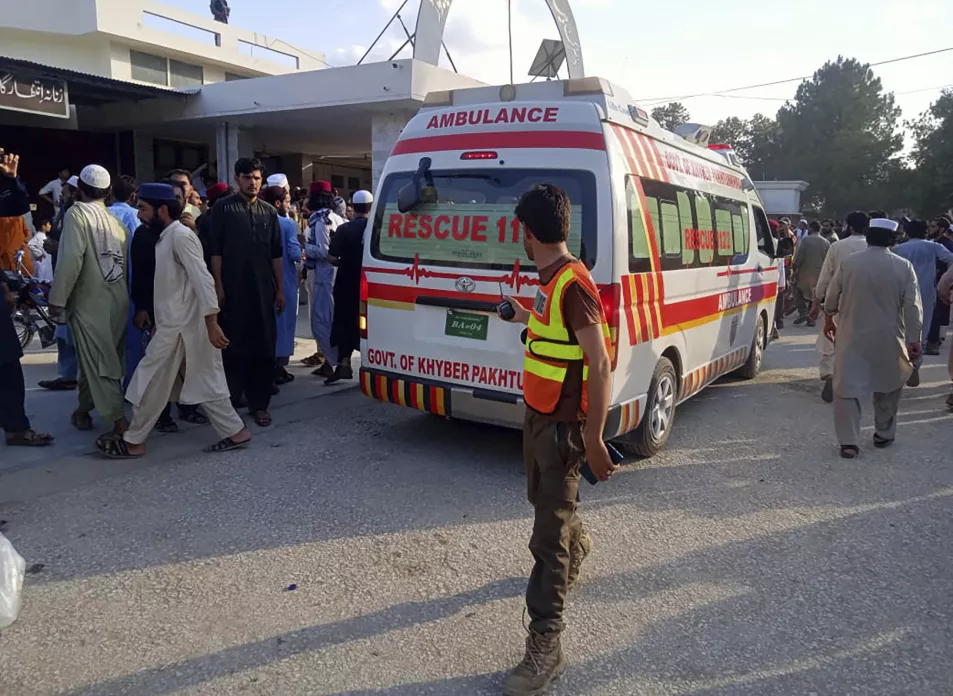 An ambulance carries injured people after the blast