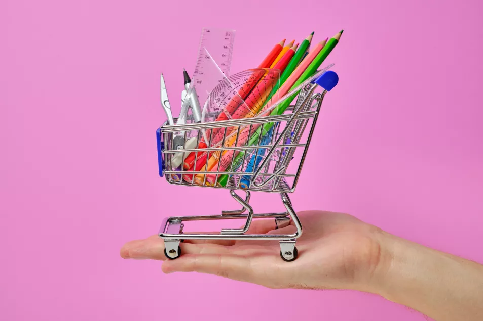 mini shopping trolley with pencils and ruler in