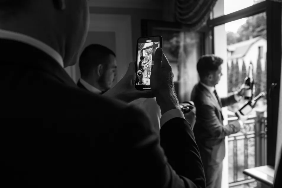 groom being photographed
