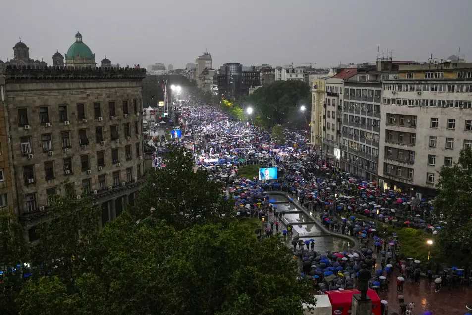 People attend a rally in support of Aleksandar Vucic in front of the Serbian parliament 