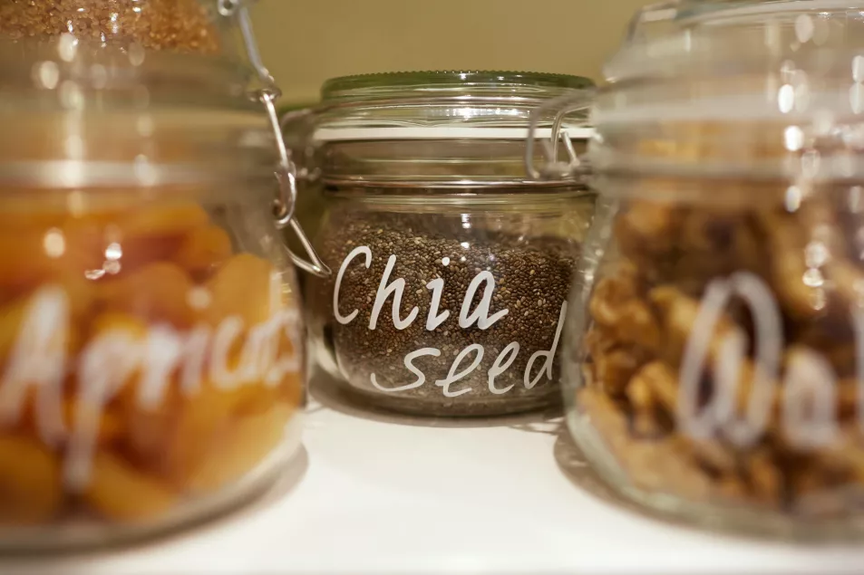Glass storage jars with dried fruit and seeds