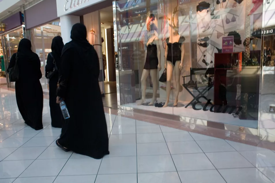 Muslim women wearing black abayas 