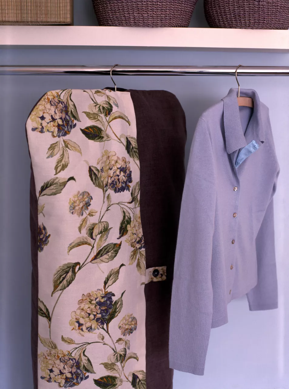 Floral clothes protector in wardrobe