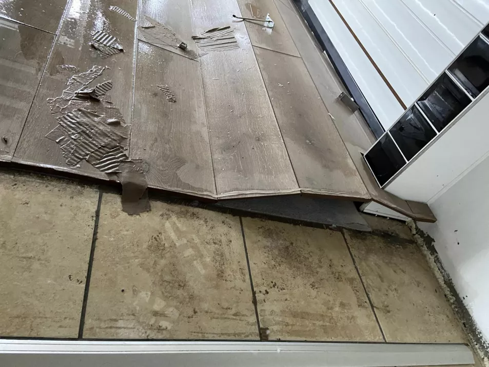 The floor of Ciara Douglas' shop showing warped flooring following the flooding 