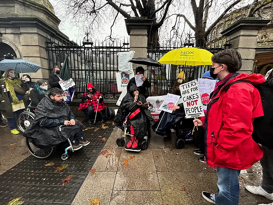 Disability groups protest outside Leinster House in Dublin over proposals to reform disability payments 