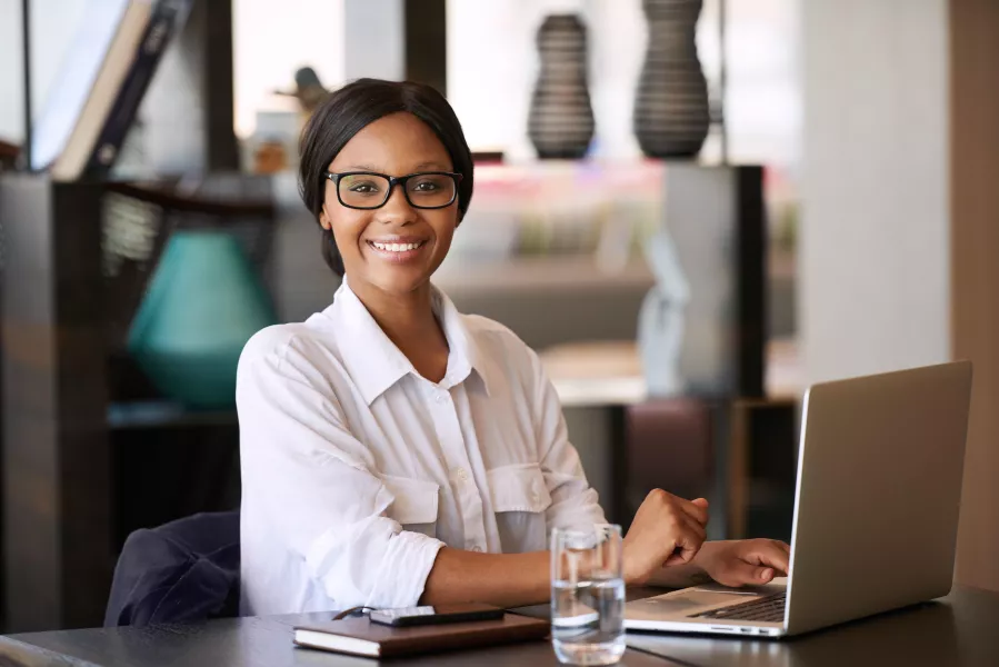 Woman doing personal finances on laptop