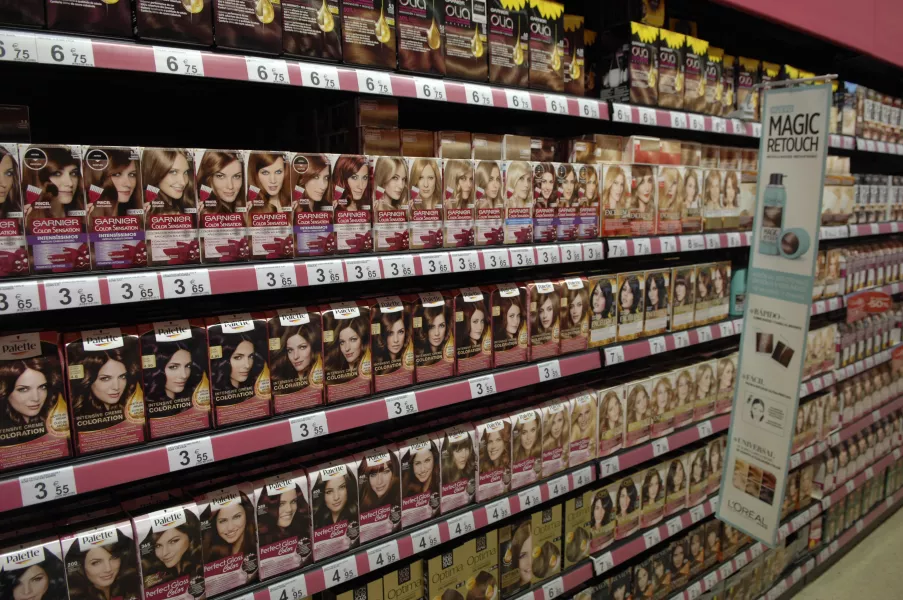 hair dye products on supermarket shelves