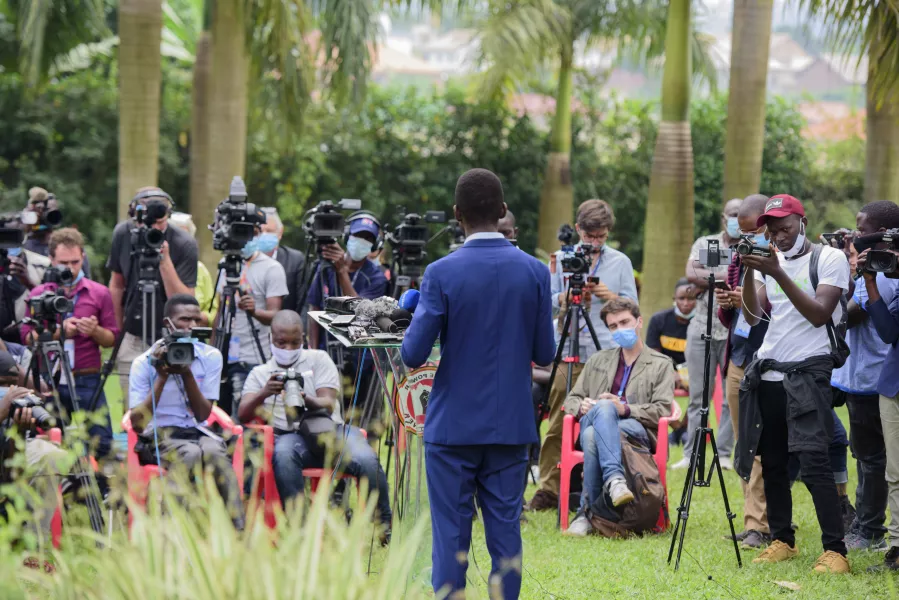 Mr Wine addresses the media at his home in Magere on  Friday 