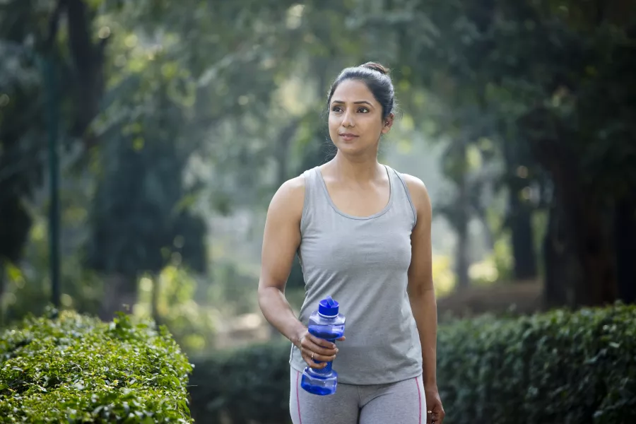 Asian woman exercising outdoors in the park 