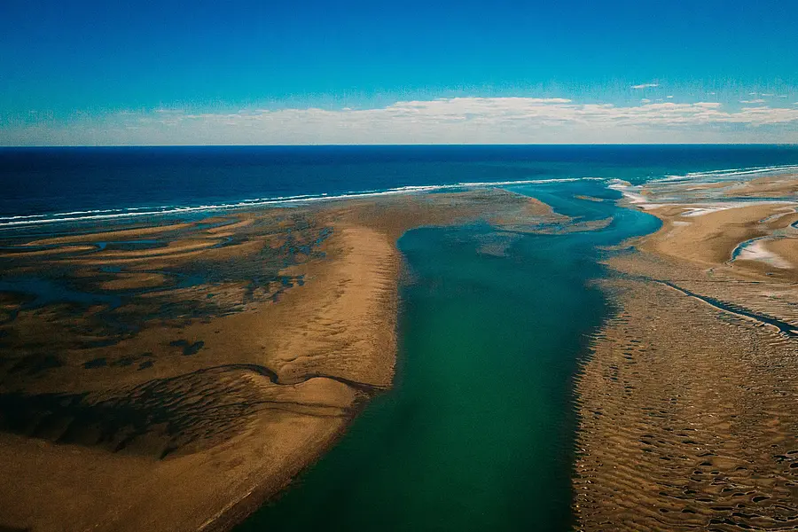 A large river flowing out into the sea