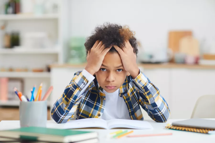 Little boy struggling with learning (iStock/PA)
