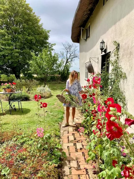 Rebecca Lovatt tends her beautiful cottage garden (Rebecca Lovatt/PA)