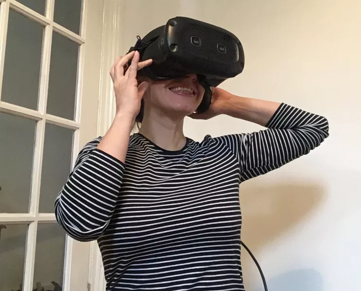 Journalist Abi Jackson wearing a VR headset