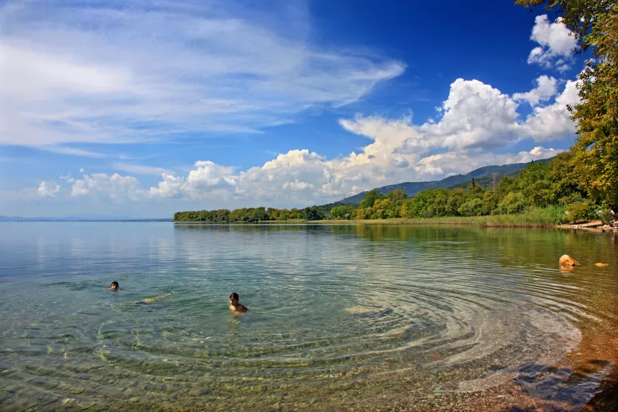 Children swimming in a lake in Greece