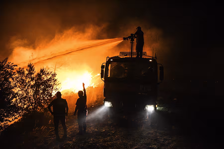 Firefighters in Kirli village in Antalya province 