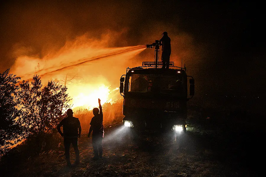 Firefighters in Kirli village in Antalya province 