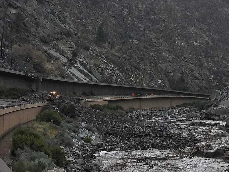 Equipment works to clear mud and debris from a mudslide on Interstate-70 through Glenwood Canyon, Colorado