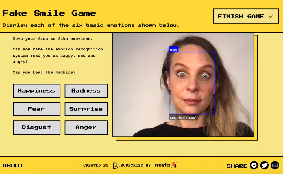 Dr Alexa Hagerty plays a game on the Emojify website, which demonstrates AI emotion recognition technology. (Cambridge University/ PA)