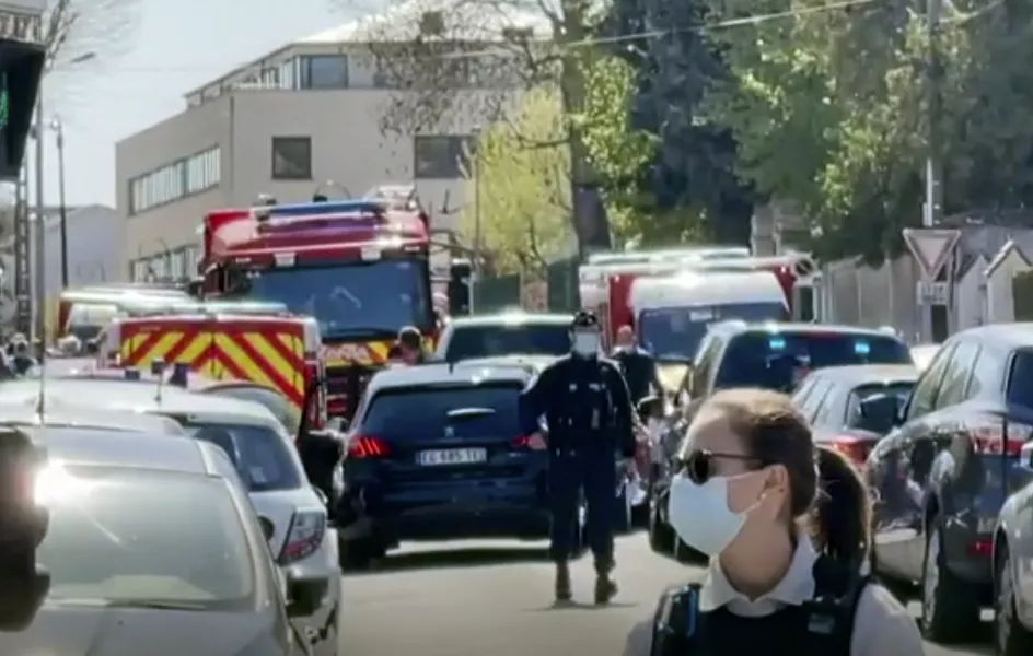 Police near the scene of a stabbing at a police station in Rambouillet, south-west of Paris 